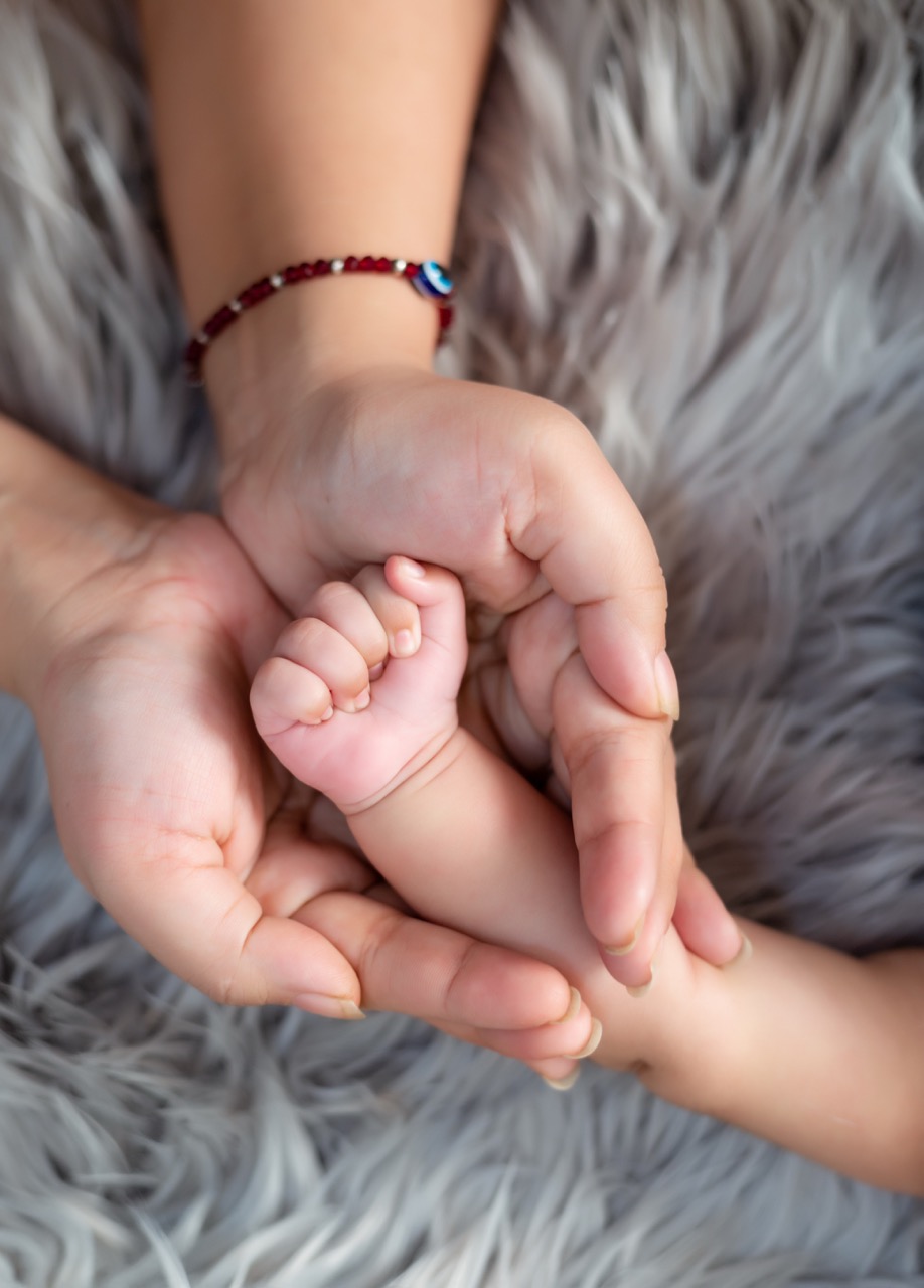 A smiling baby during a professional photoshoot.